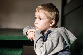 serious caucasian child Boy looking Wistful