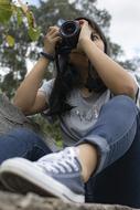 Photographer, young girl Taking Photo