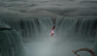 girl on rope over Waters Movement River
