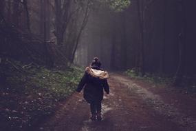 Little Girl on Road in Forest