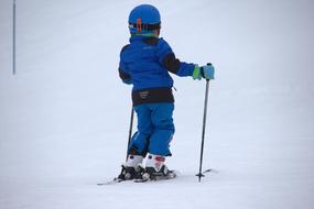 child skiing on a hillside