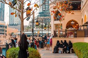 photo of people near a shopping center in Dubai