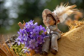 vintage stuffed toy with bouquet of blue Flowers
