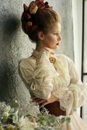 girl in a vintage dress near the window