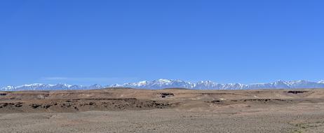 Beautiful landscape of the desert in Morocco and snowy mountains, in Africa