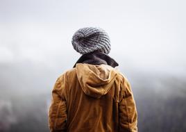 back view of person in grey hat