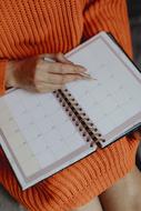 diary in the hands of a woman