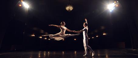 show Ballet on stage in the color of spotlights