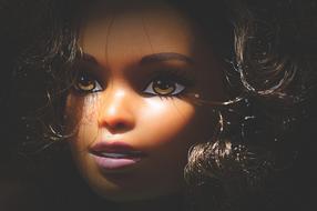 portrait of a dark-skinned Barbie doll