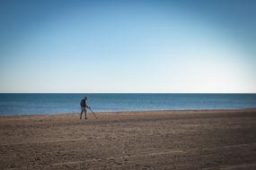 Man metal Detection on Beach