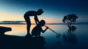 Fishing children at Sunset