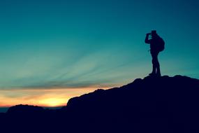 adventurer on a Mountain Top