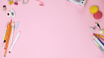 stationery on a pink table