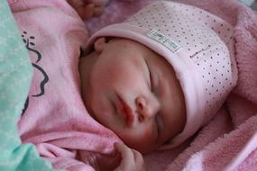 Newborn Girl in pink close-up