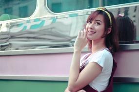 photo of a girl by a vintage bus