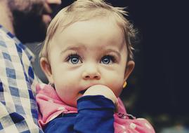 little girl with blue eyes close up