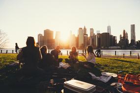 people on a picnic on the city promenade