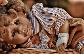 Sad crying girl doll with curly hair