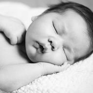 monochrome photo of a sleeping baby