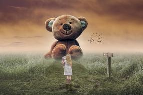 large teddy bear and tiny girl