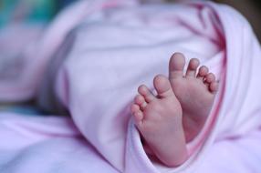 Baby Feet in pink blanket