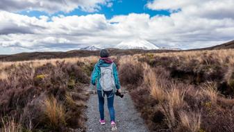 girl walking on Hiking Trail in wilderness