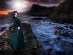 a girl in a gothic dress stands on a rock by the sea