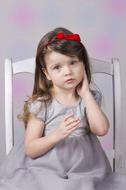 Portrait of Little Girl sitting on chair