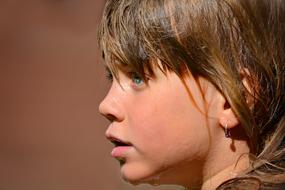 photo of a girl with a wet face and hair