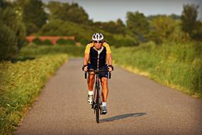 Racing Cyclist on the track on a sunny day