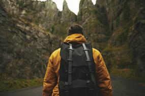 hiker with black backpack