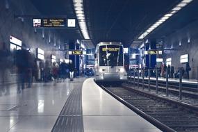 modern train in a lighted metro station