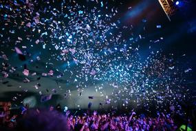 Beautiful confetti, at colorful background at night