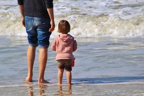 Child and man sea