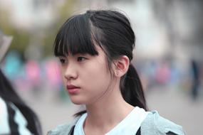 Portrait of the cute, Japanese girl, at blurred background
