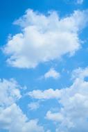 clouds of different shapes on a blue sky