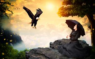 fantastic image of a girl with an umbrella on the mountain and a flying eagle