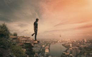 man over the city at dawn