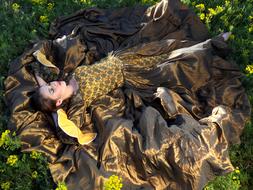 girl in a sleeping princess dress on the lawn