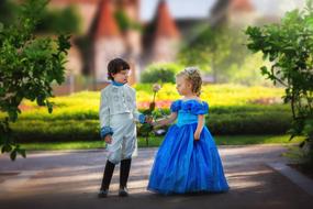 girl and boy in costumes of a princess and a prince