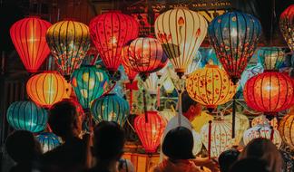 Asian Lantern Festival, people looking at traditional colorful paper lights
