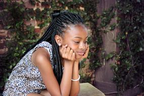 photo of a beautiful girl with african pigtails