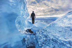 man among ice on a cloudy day