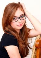 Portrait of sceptic young Girl in Glasses