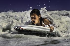 girl swims on a silver surfboard
