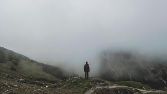 man on the mountain during the fog