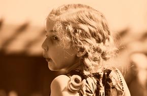 monochrome photo of a girl with curly hair