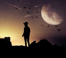 man on top of a mountain amid a flock of bats and a big moon