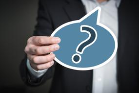 Question Mark Balloon in the hand of a business man