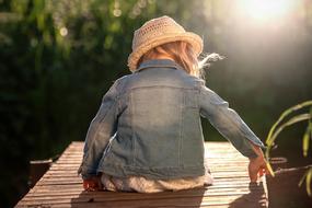 little girl on the wooden pier